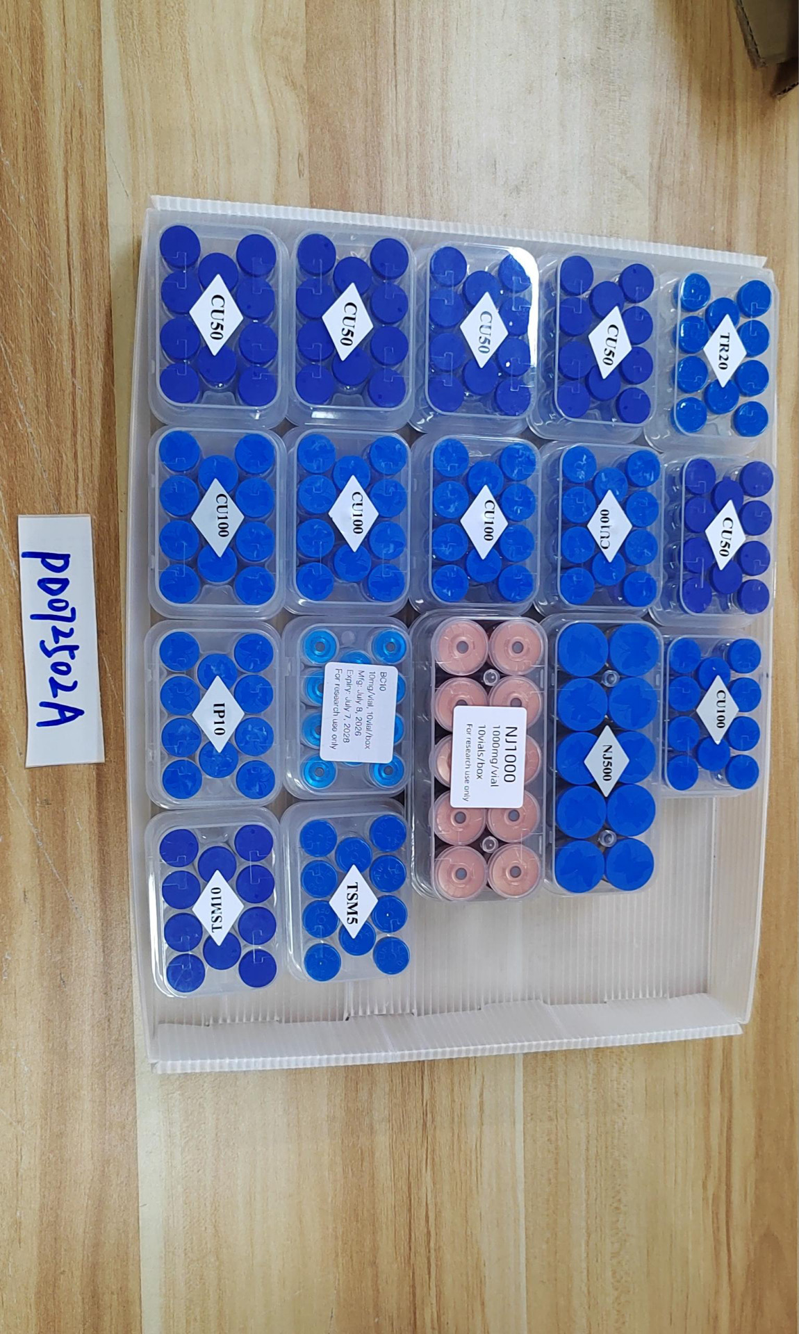 Blue-cap research peptide vial presentation 9